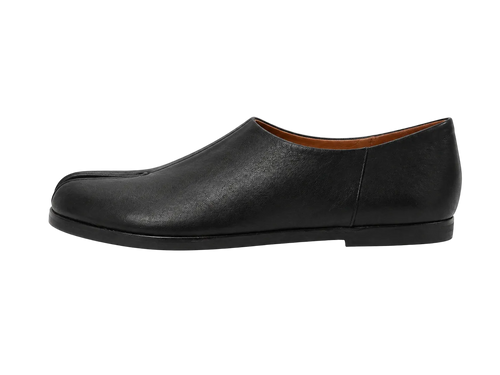 Black leather slip-on shoe on a white background